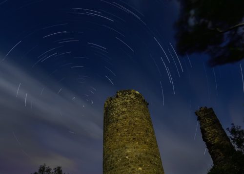 Star trails over Les Escaules castle