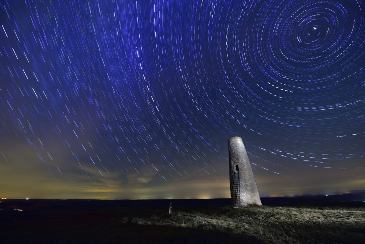 Star trails over islamic watchover tower